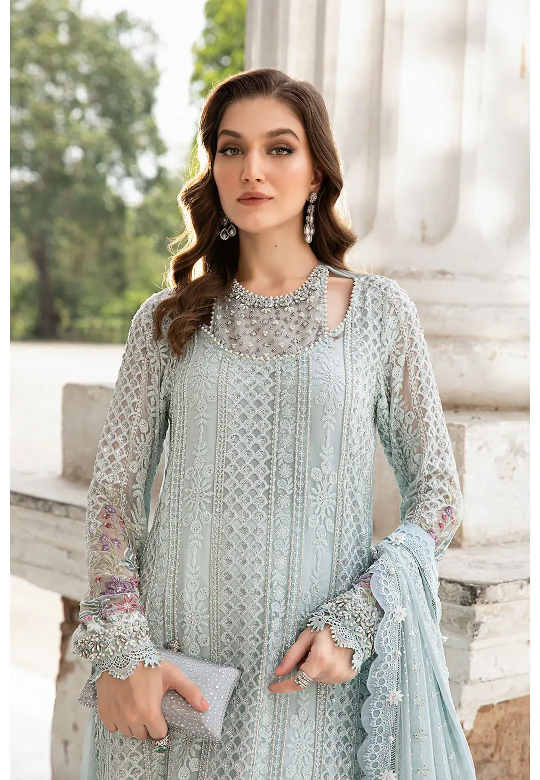 457031245_984541680379763_4487881433107751804_n_1800x1800-1.webp Luxurious chiffon formal wear in icy blue, adorned with lacework, bead embellishments, and a floral embroidered dupatta.