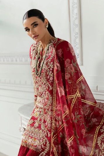 35 Stunning Pakistani wedding ensemble with delicate zardozi and sequins, complemented by a regal bridal dupatta.