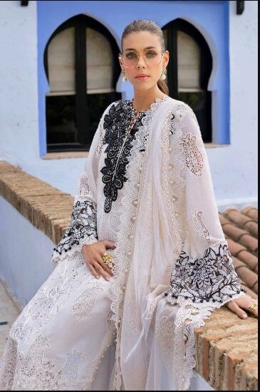wb5 Luxury designer lawn outfit featuring black lace embroidery on a white fabric base.