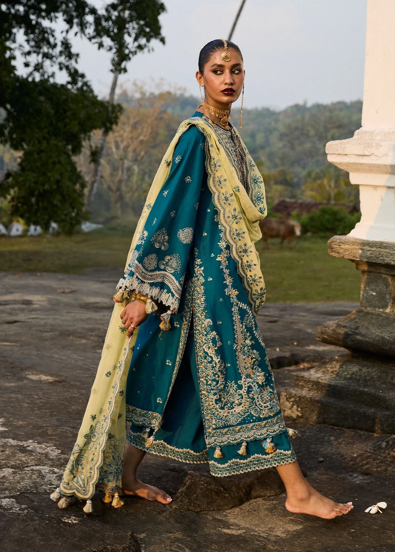 Luxury Festive Wear – Teal Blue Traditional Ensemble Elegant teal blue designer outfit with traditional embellishments.