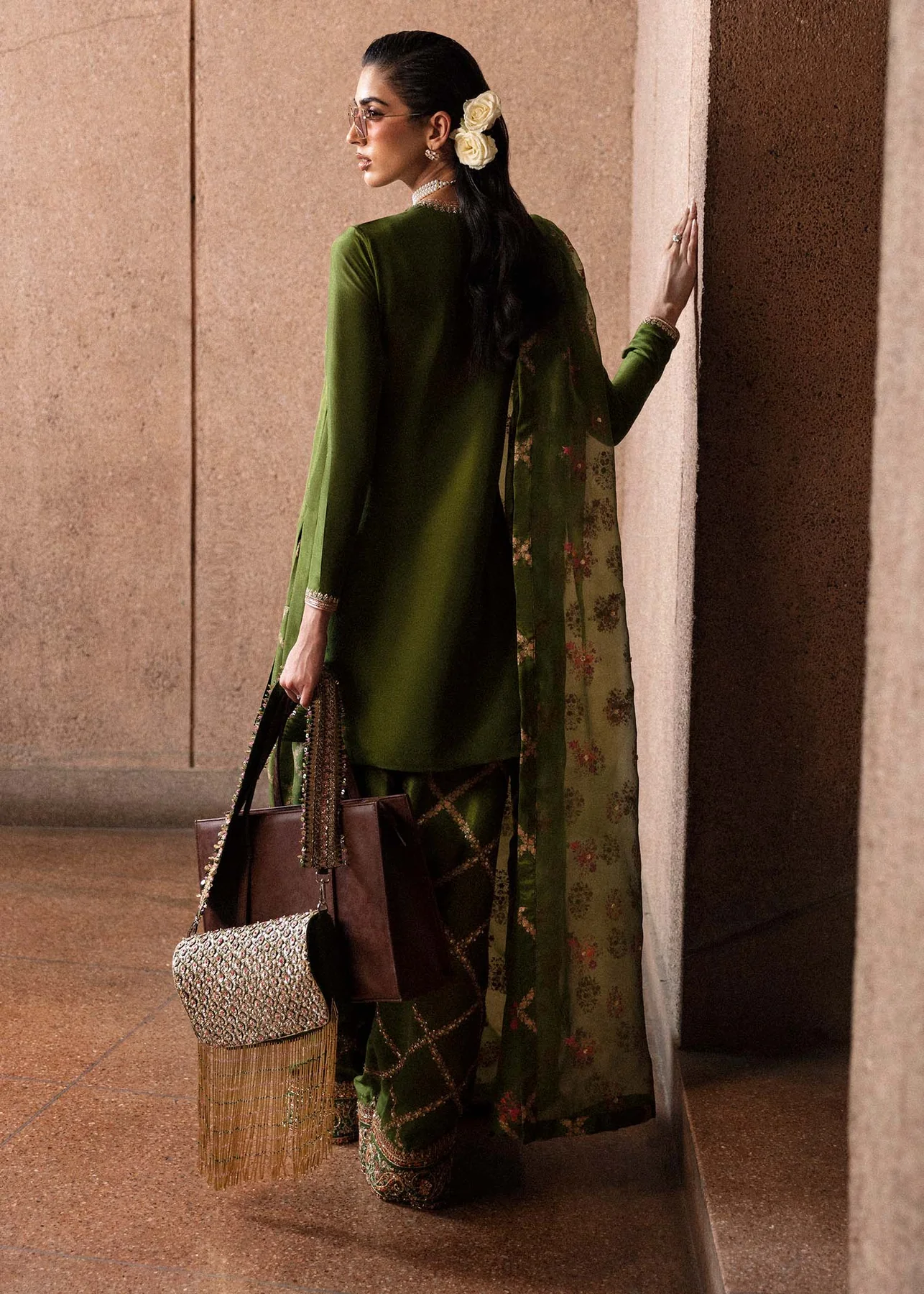 Designer Olive Green Saree-Inspired Outfit Luxury olive green festive outfit styled with pearls and embroidery.