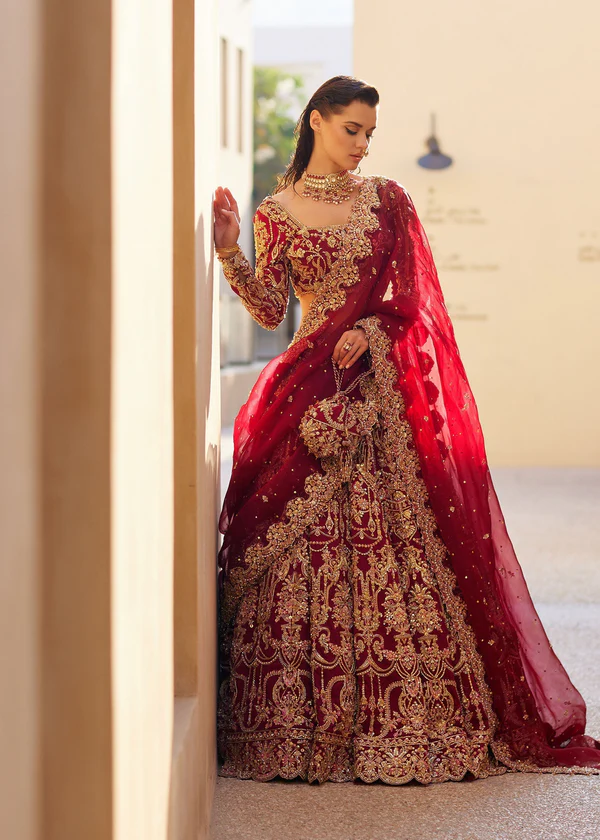 Traditional Maroon Lehenga for Pakistani Brides Elegant bridal dress with heavy embellishment with artistry in craftsmanship.