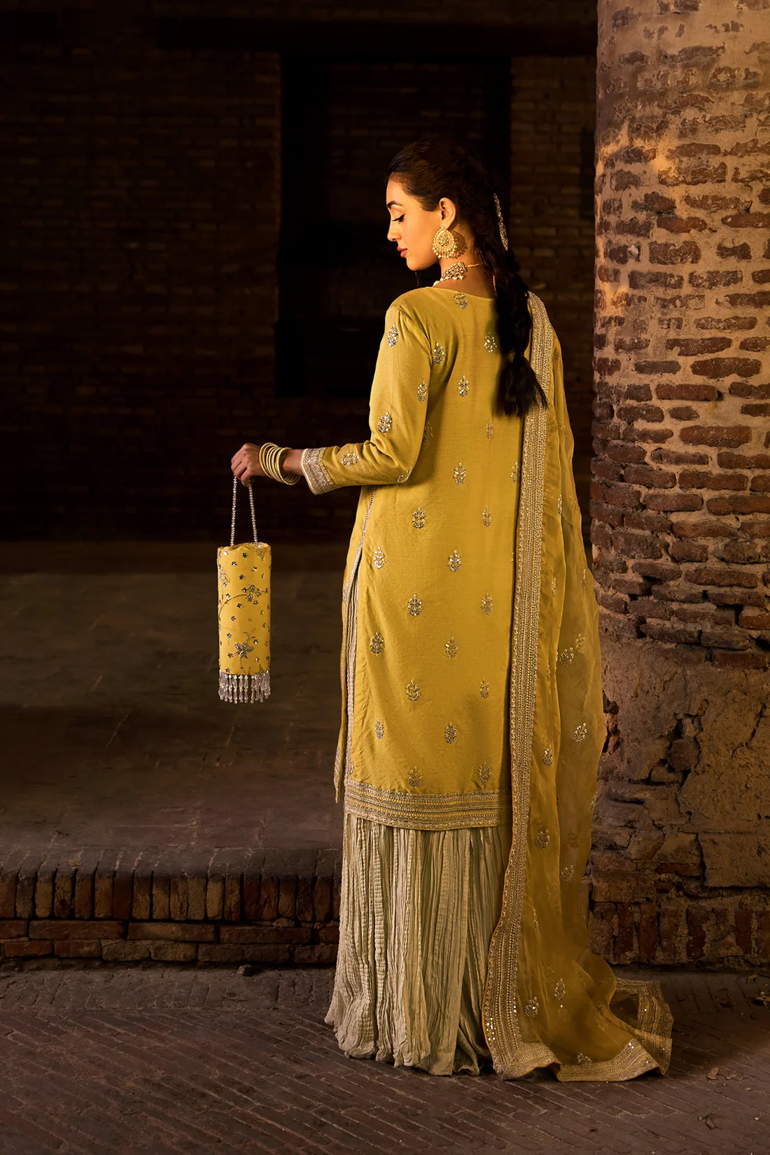 Golden Embroidered Formal Outfit for Women Designer women’s festive attire in golden shade with detailed embroidery.