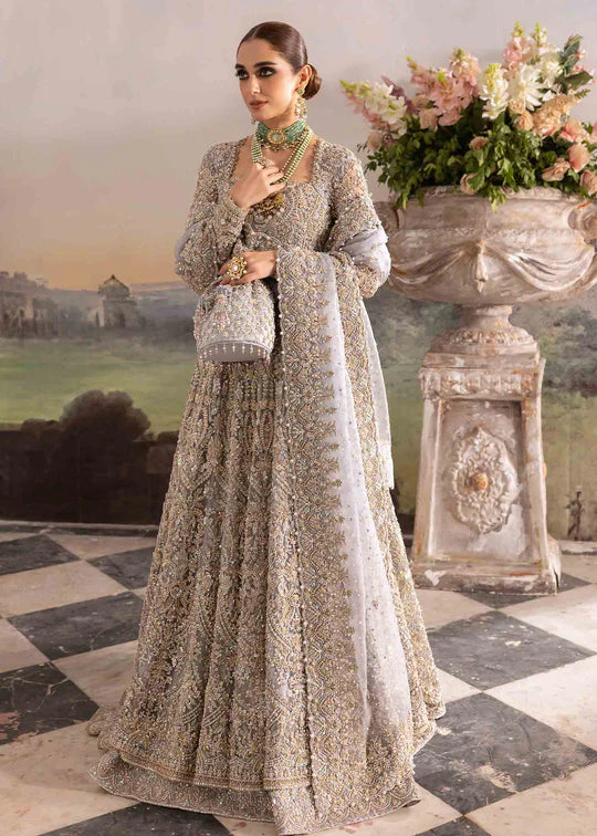 Kanwal Malik Tania – A Bridal Masterpiece of Elegance and Luxury Intricately hand-embroidered bridal dress by Kanwal Malik Tania, featuring luxurious fabric, delicate embellishments, and a regal silhouette.