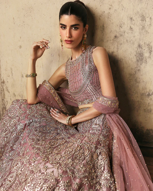 Luxury pastel pink ensemble for bridal and festive looks . Embroidered wedding dress in pastel pink for women