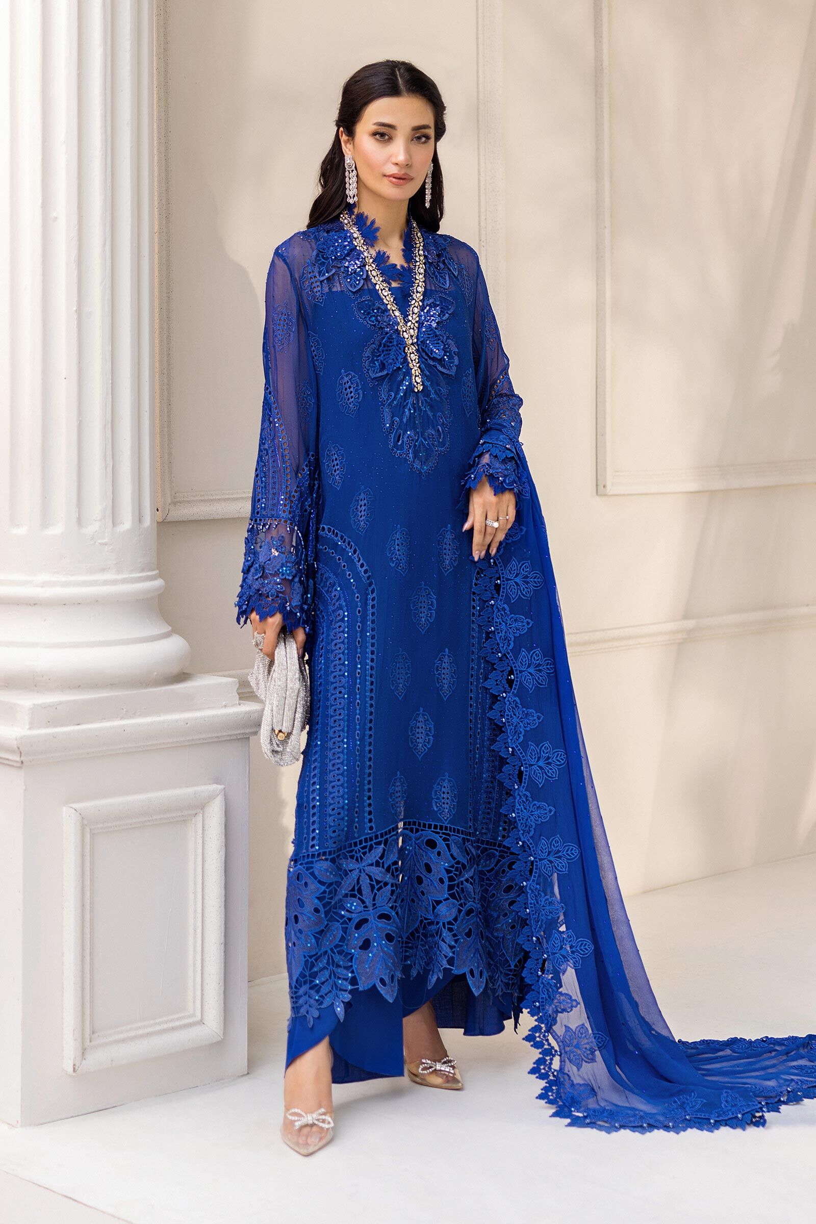 Elegant blue outfit from Maria B Chiffon Collection with delicate embroidery and premium fabric.