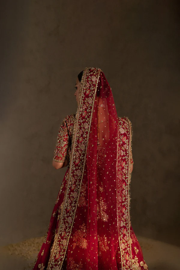 zuria-dor-hot-pink-bridal-lehenga-choli-5 Traditional red lehenga with floral embellishments and artisan workmanship.