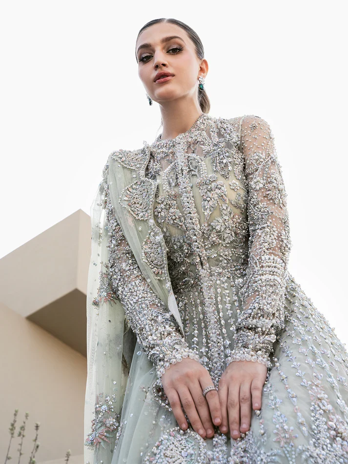Mint & Silver Hand-Embroidered Pakistani Bridal Maxi Dress : Closeup shot of detailed silver dabka work on luxury long sleeve Pakistani bridal dress.