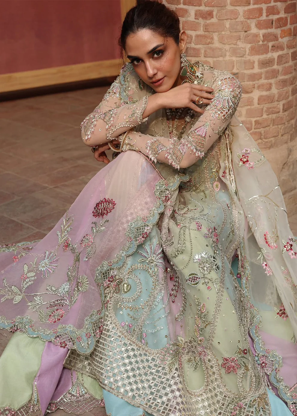 Multi-Pastel Heavily Embroidered Net Lehenga Ensemble Formal designer bridal long shirt with flared lehenga skirt and scalloped net dupatta